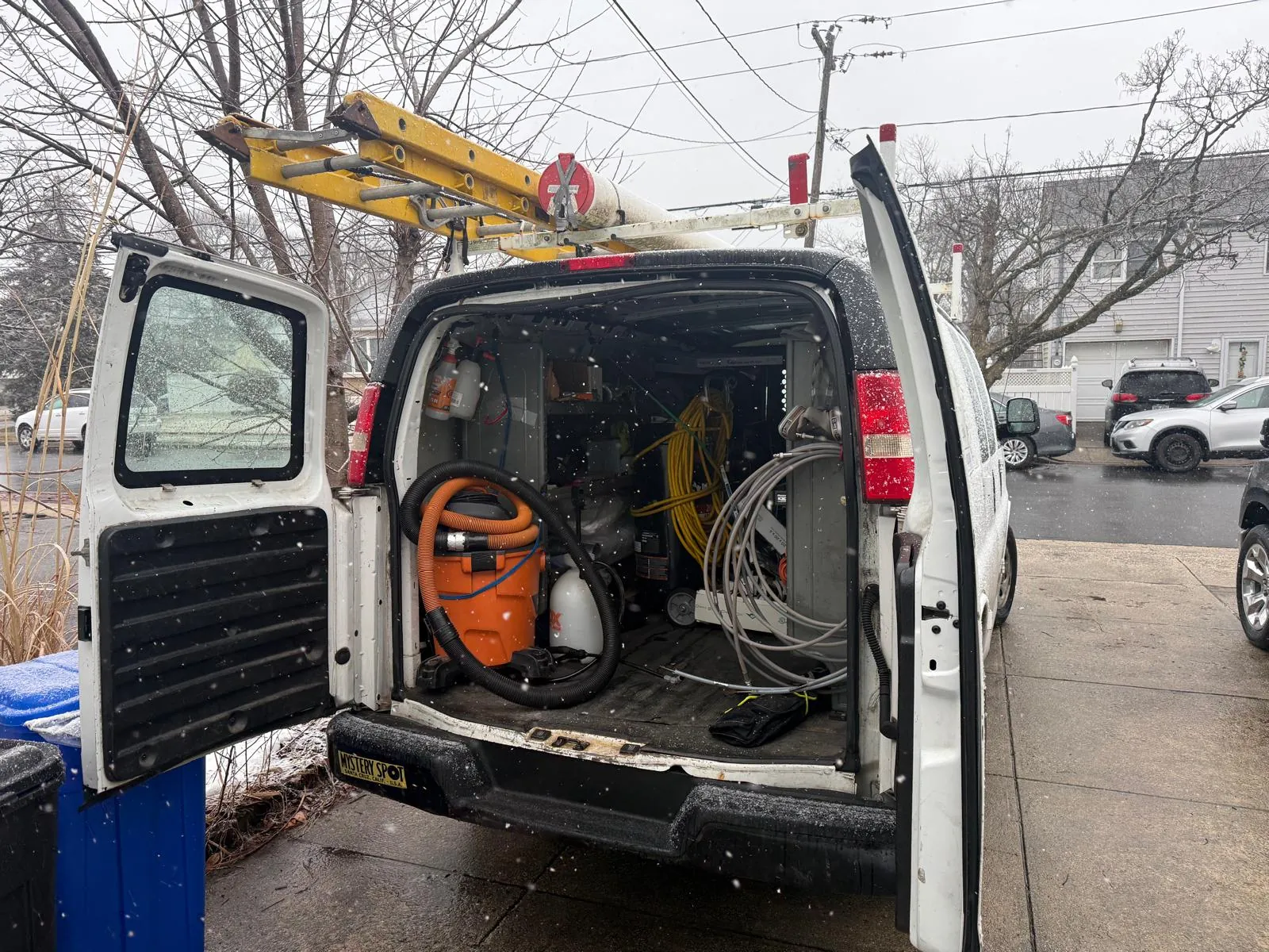 Dryer vent cleaning service van with professional equipment in Nassau County